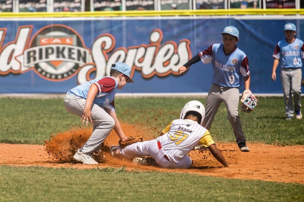 Baseball player sliding into a base